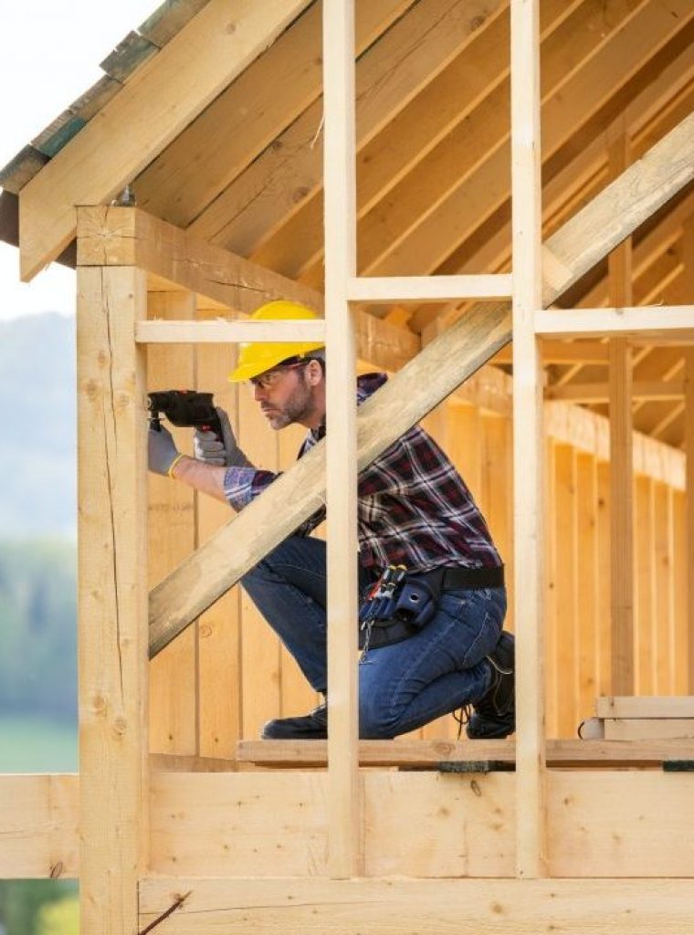 roofer-builder-working-on-roof-structure-at-construction-site.jpg
